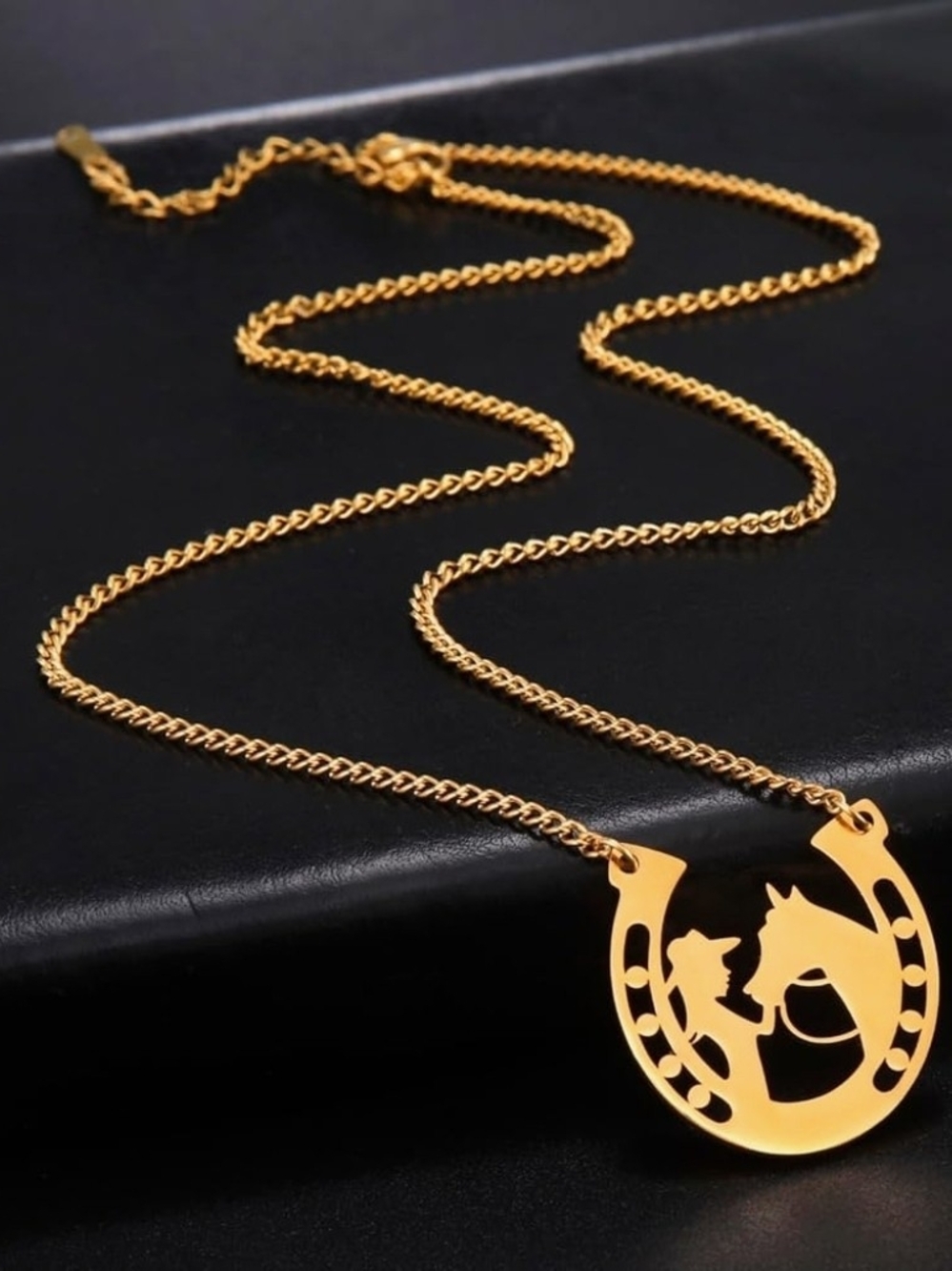 NWOT Stainless Gold Horseshoe Necklace with Horse & Rider Silhouette.